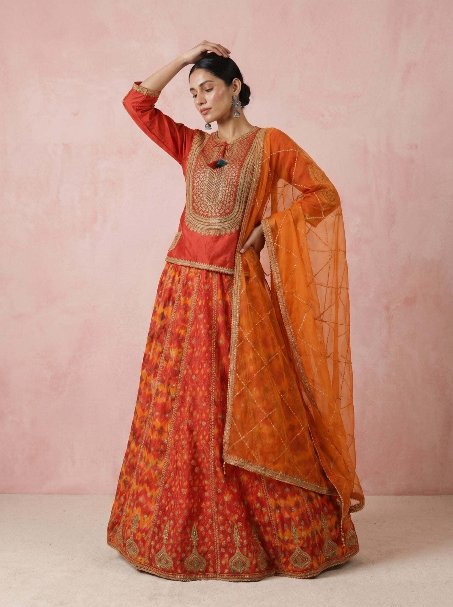 women wearing a red silk lehenga set