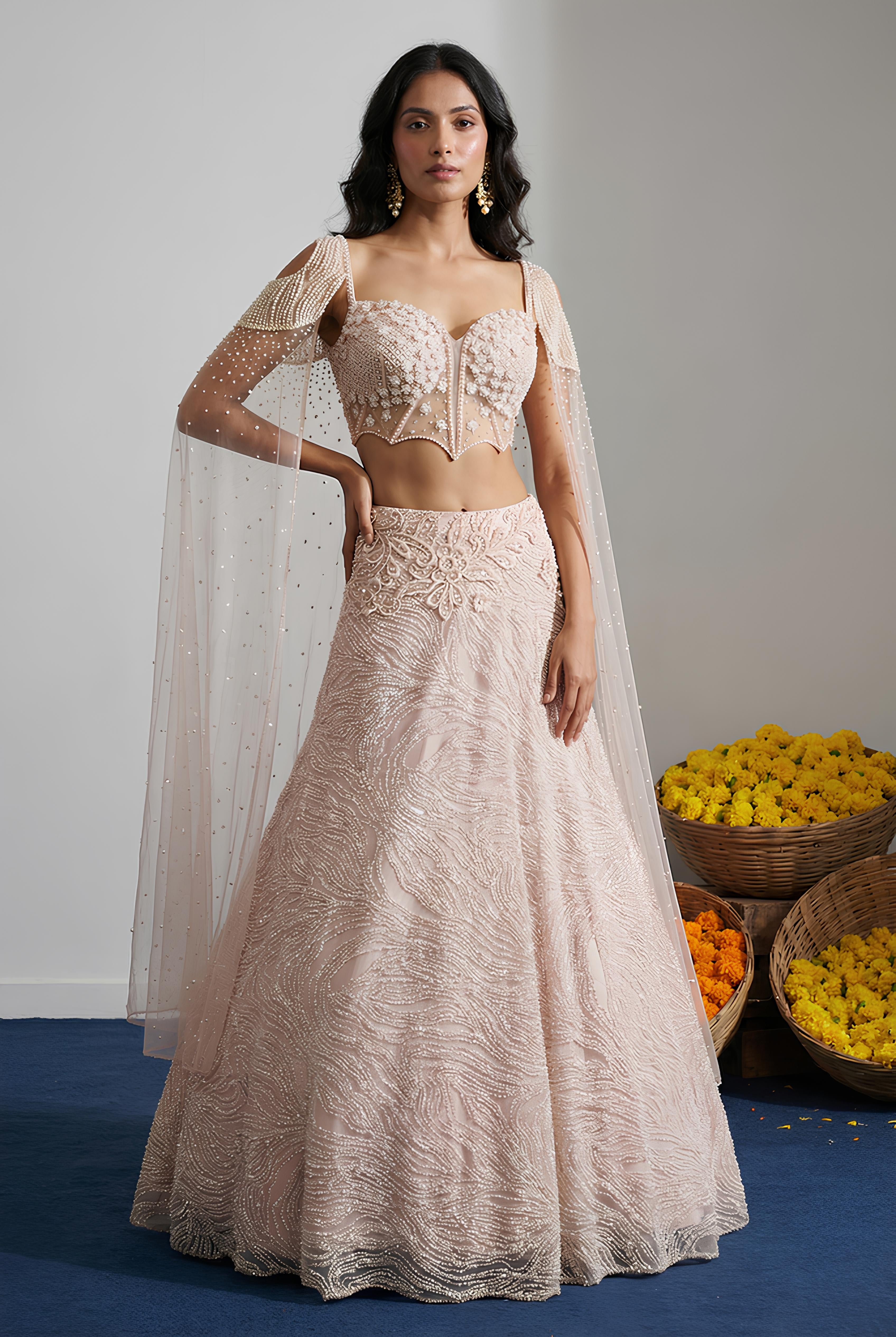 Woman wearing a traditional outfit with a white background and flowers in the foreground